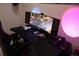 A well organized home office with a curved monitor and gaming accessories at 6002 Renaissance Ct, St Cloud, FL 34772