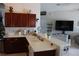 Spacious kitchen area with a breakfast bar overlooking the living room, perfect for entertaining at 6002 Renaissance Ct, St Cloud, FL 34772