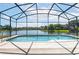 Screened-in pool with lake view at 6002 Renaissance Ct, St Cloud, FL 34772