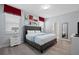 Bedroom with a king-size bed, gray upholstered headboard, and wood floors at 641 Pebble Beach Dr, Davenport, FL 33896