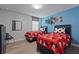 ' bedroom with two twin beds, Mickey Mouse bedding, and blue walls at 641 Pebble Beach Dr, Davenport, FL 33896