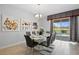 Bright dining room with table and chairs and view of the pool at 641 Pebble Beach Dr, Davenport, FL 33896