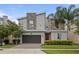 Two-story modern home with stone accents and landscaped yard at 641 Pebble Beach Dr, Davenport, FL 33896