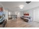 Upstairs game room with sectional sofa and hardwood floors at 641 Pebble Beach Dr, Davenport, FL 33896