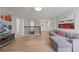 Upstairs game room with sectional sofa and hardwood floors at 641 Pebble Beach Dr, Davenport, FL 33896