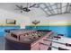 Garage converted into a game room with foosball and pool table at 641 Pebble Beach Dr, Davenport, FL 33896