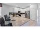 Modern kitchen island with seating and stainless steel appliances at 641 Pebble Beach Dr, Davenport, FL 33896
