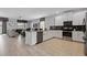 Open concept kitchen with island and stainless steel appliances at 641 Pebble Beach Dr, Davenport, FL 33896