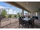 Screened patio with pool, spa, and outdoor seating at 641 Pebble Beach Dr, Davenport, FL 33896