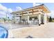 Community pool bar with outdoor seating at 641 Pebble Beach Dr, Davenport, FL 33896