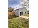 House backyard with sliding glass doors and patio at 656 Oakford Way, Orlando, FL 32811