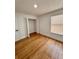 Bright bedroom with wood-look floors and spacious closet at 656 Oakford Way, Orlando, FL 32811