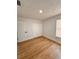 Simple bedroom with light wood flooring and double door closet at 656 Oakford Way, Orlando, FL 32811