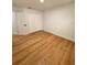 Bright bedroom with light wood flooring and double door closet at 656 Oakford Way, Orlando, FL 32811
