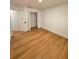 Simple bedroom with light wood flooring and double door closet at 656 Oakford Way, Orlando, FL 32811