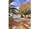Newly constructed home with two-car garage and ample driveway, surrounded by mature trees at 656 Oakford Way, Orlando, FL 32811