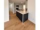 Modern kitchen with island, stainless steel appliances, and light gray cabinets at 656 Oakford Way, Orlando, FL 32811