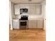 Updated kitchen featuring stainless steel appliances and quartz countertops at 656 Oakford Way, Orlando, FL 32811