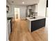 Modern kitchen with island, stainless steel appliances, and light gray cabinets at 656 Oakford Way, Orlando, FL 32811