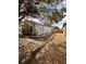 Gray house with a side yard and walkway at 656 Oakford Way, Orlando, FL 32811