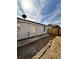 Gray house with a side yard and wooden fence at 656 Oakford Way, Orlando, FL 32811