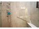 Shower with built-in seat and grab bar at 7637 Sand Pierre Ct, Kissimmee, FL 34747