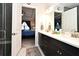 Double vanity bathroom with view into bedroom at 7637 Sand Pierre Ct, Kissimmee, FL 34747