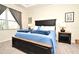 Main bedroom with king-size bed and nightstands at 7637 Sand Pierre Ct, Kissimmee, FL 34747
