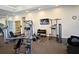 Modern fitness center with various equipment at 7637 Sand Pierre Ct, Kissimmee, FL 34747