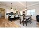 Open concept kitchen with island, breakfast bar, and dining area at 7637 Sand Pierre Ct, Kissimmee, FL 34747