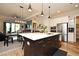 Open kitchen with large island, stainless steel appliances, and white cabinets at 7637 Sand Pierre Ct, Kissimmee, FL 34747