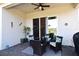 Covered patio with wicker furniture and a view of the backyard at 7637 Sand Pierre Ct, Kissimmee, FL 34747