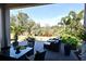 Spacious patio with seating area, lush landscaping, and a tranquil view at 7637 Sand Pierre Ct, Kissimmee, FL 34747