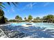 Relaxing resort-style pool with lounge chairs at 7637 Sand Pierre Ct, Kissimmee, FL 34747