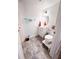 Bright bathroom with a white vanity, oval mirror, and wood-look flooring that creates a clean and inviting space at 768 E Michigan St # 75, Orlando, FL 32806