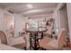 Bright dining area with round table and plush seating, open to a cozy living space at 768 E Michigan St # 75, Orlando, FL 32806