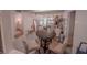 Bright dining area with round table and plush seating, open to a cozy living space at 768 E Michigan St # 75, Orlando, FL 32806