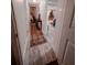 Hallway with wood-look tile flooring leads to the living room and bedrooms at 768 E Michigan St # 75, Orlando, FL 32806