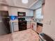 Kitchen with light-colored cabinets and stainless steel appliances at 768 E Michigan St # 75, Orlando, FL 32806