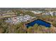 Aerial view of house location in neighborhood near a pond at 836 Lake Evalyn Dr, Celebration, FL 34747