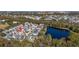 Aerial view of house and neighborhood, close to a pond at 836 Lake Evalyn Dr, Celebration, FL 34747