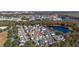 Aerial view of the home and surrounding neighborhood near a pond at 836 Lake Evalyn Dr, Celebration, FL 34747