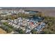 Aerial view of home nestled in a neighborhood near a pond at 836 Lake Evalyn Dr, Celebration, FL 34747
