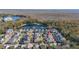 Aerial view of house and neighborhood by a pond at 836 Lake Evalyn Dr, Celebration, FL 34747