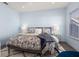 Bright bedroom with a king-size bed and ample natural light at 836 Lake Evalyn Dr, Celebration, FL 34747