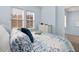 Charming bedroom with a queen-size bed and natural light at 836 Lake Evalyn Dr, Celebration, FL 34747