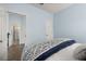 Bedroom with a view of the bathroom and a patterned comforter at 836 Lake Evalyn Dr, Celebration, FL 34747