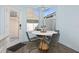 Bright breakfast nook features a round table and four chairs, offering a charming space at 836 Lake Evalyn Dr, Celebration, FL 34747