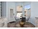 Bright breakfast nook features a round table and four chairs, offering a charming space at 836 Lake Evalyn Dr, Celebration, FL 34747