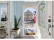 Bright entryway with glass door and view of front porch at 836 Lake Evalyn Dr, Celebration, FL 34747
